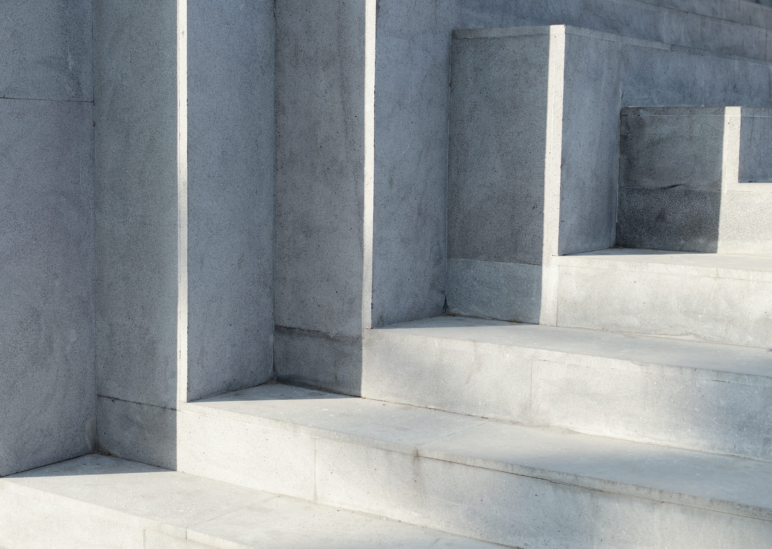 Abstract background - play of light on concrete stairs.